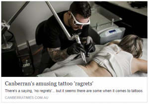 A tattoo artist working on a client's back while they lie on a table, with the tattoo machine in use. The image is accompanied by a headline discussing tattoos and regrets